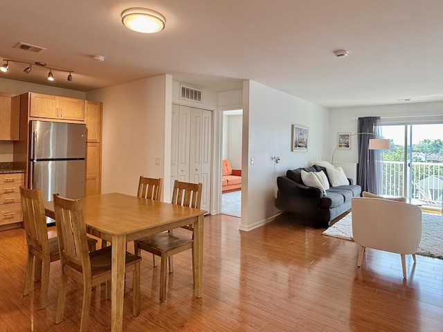 34 Schoolhouse Dr Unit 405, West Hartford, CT 06110 - dining area with light wood-type flooring and baseboards