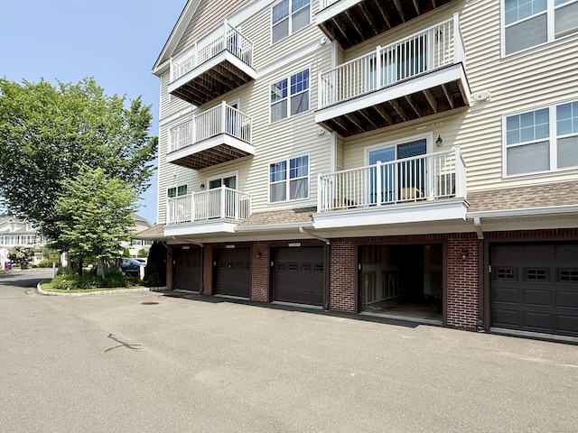 34 Schoolhouse Dr Unit 405, West Hartford, CT 06110 - view of property featuring an attached garage