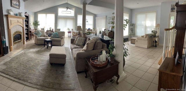 42 Bluff St, Westbrook, CT 06498 - living room with light tile patterned floors, ornate columns, a ceiling fan, lofted ceiling, and a tile fireplace