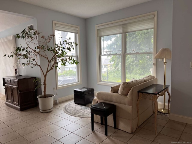 42 Bluff St, Westbrook, CT 06498 - living area with healthy amount of natural light and light tile patterned floors