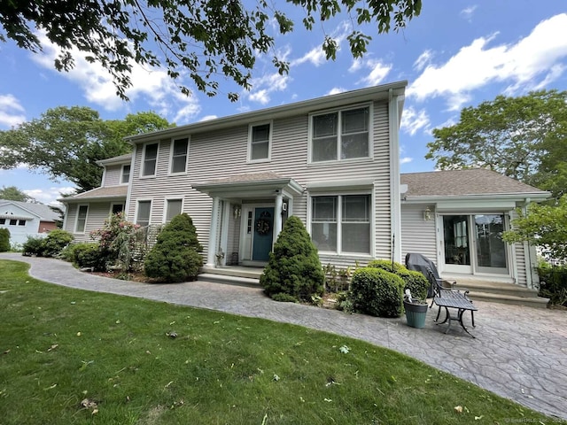 42 Bluff St, Westbrook, CT 06498 - back of house with a lawn and a patio area