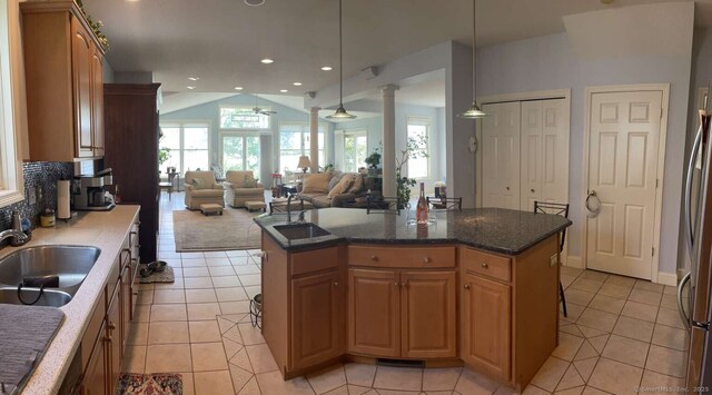 42 Bluff St, Westbrook, CT 06498 - kitchen with light tile patterned flooring, a ceiling fan, lofted ceiling, open floor plan, and ornate columns