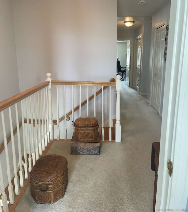 42 Bluff St, Westbrook, CT 06498 - hall featuring an upstairs landing and carpet flooring