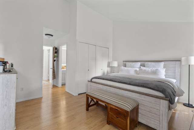 32 Glenview Dr Unit 32, Cromwell, CT 06416 - bedroom featuring light wood-type flooring, a closet, and a towering ceiling