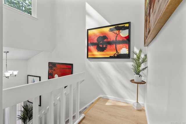 32 Glenview Dr Unit 32, Cromwell, CT 06416 - corridor featuring a chandelier, light wood-style floors, and an upstairs landing