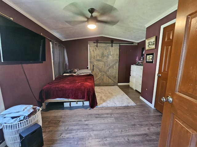 91 Chaffeeville Rd Trlr 16, Mansfield, CT 06250 - bedroom featuring a barn door, vaulted ceiling, wood finished floors, crown molding, and ceiling fan