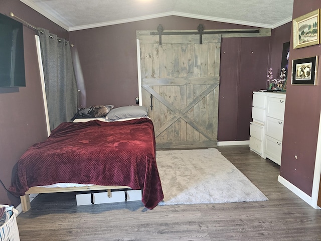 91 Chaffeeville Rd Trlr 16, Mansfield, CT 06250 - bedroom with a barn door, wood finished floors, and ornamental molding