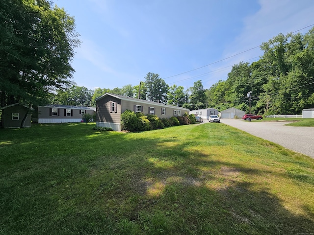 91 Chaffeeville Rd Trlr 16, Mansfield, CT 06250 - view of front facade with a front lawn