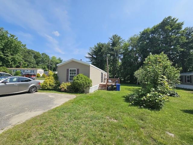 91 Chaffeeville Rd Trlr 16, Mansfield, CT 06250 - view of property exterior with a lawn