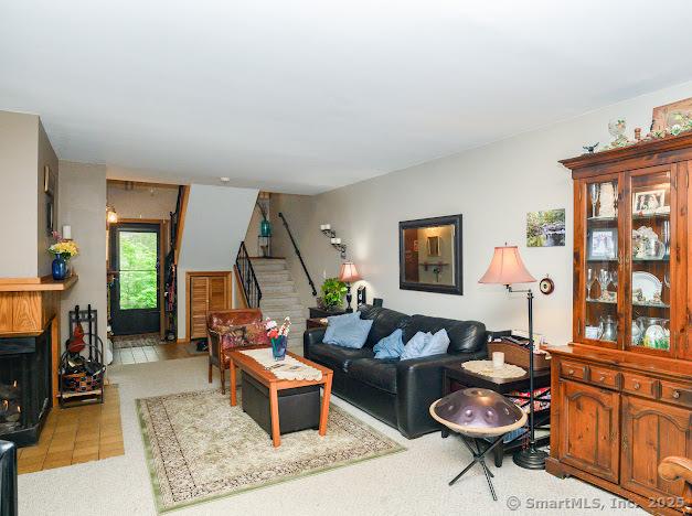 172 Old Farms Rd Unit 172, Torrington, CT 06790 - living room featuring stairs