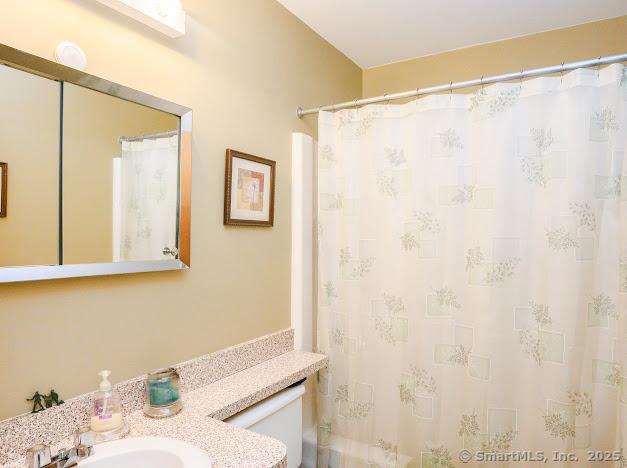 172 Old Farms Rd Unit 172, Torrington, CT 06790 - full bath featuring vanity and a shower with shower curtain