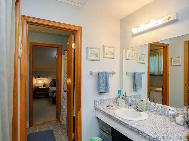 172 Old Farms Rd Unit 172, Torrington, CT 06790 - bathroom with vanity, ensuite bathroom, and tile patterned flooring