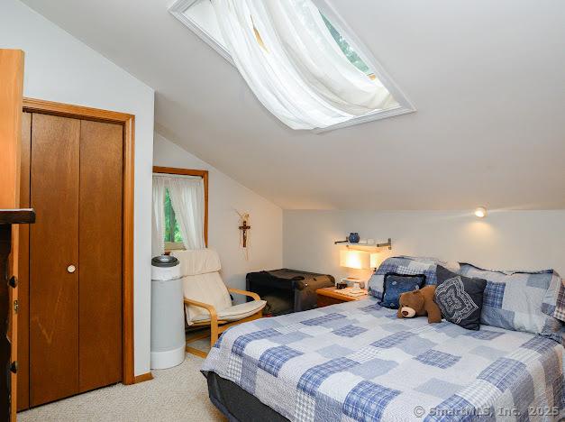 172 Old Farms Rd Unit 172, Torrington, CT 06790 - bedroom with vaulted ceiling and light colored carpet