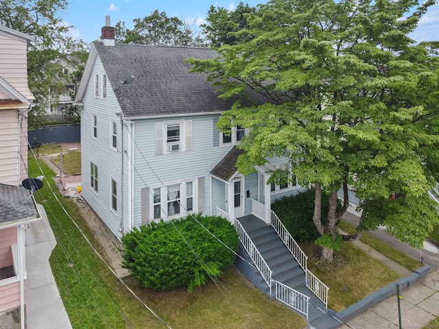 73 Atwater St, Bridgeport, CT 06604 - view of front facade with a chimney and a shingled roof