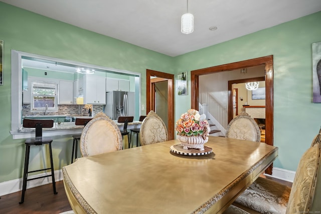 73 Atwater St, Bridgeport, CT 06604 - dining area with dark wood-style flooring and stairs