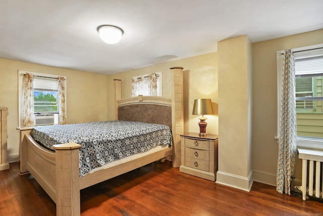73 Atwater St, Bridgeport, CT 06604 - bedroom featuring dark wood-style flooring, cooling unit, and radiator