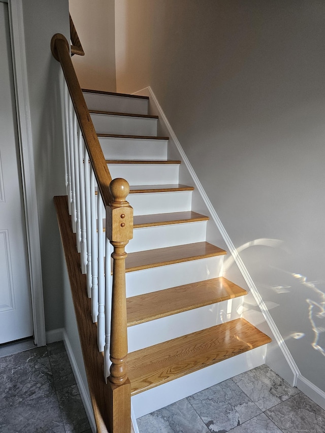 26 Roger Ave, Danbury, CT 06810 - staircase with marble finish flooring and baseboards