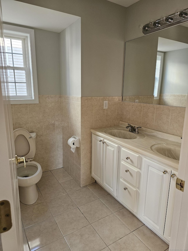 26 Roger Ave, Danbury, CT 06810 - bathroom featuring tile walls, tile patterned floors, wainscoting, and double vanity