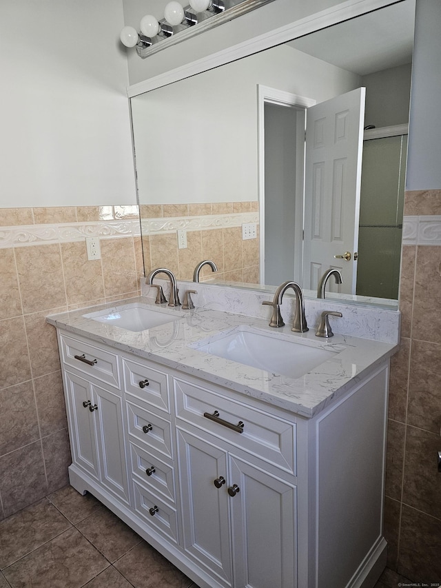 26 Roger Ave, Danbury, CT 06810 - full bathroom with tile walls, double vanity, tile patterned floors, and a wainscoted wall