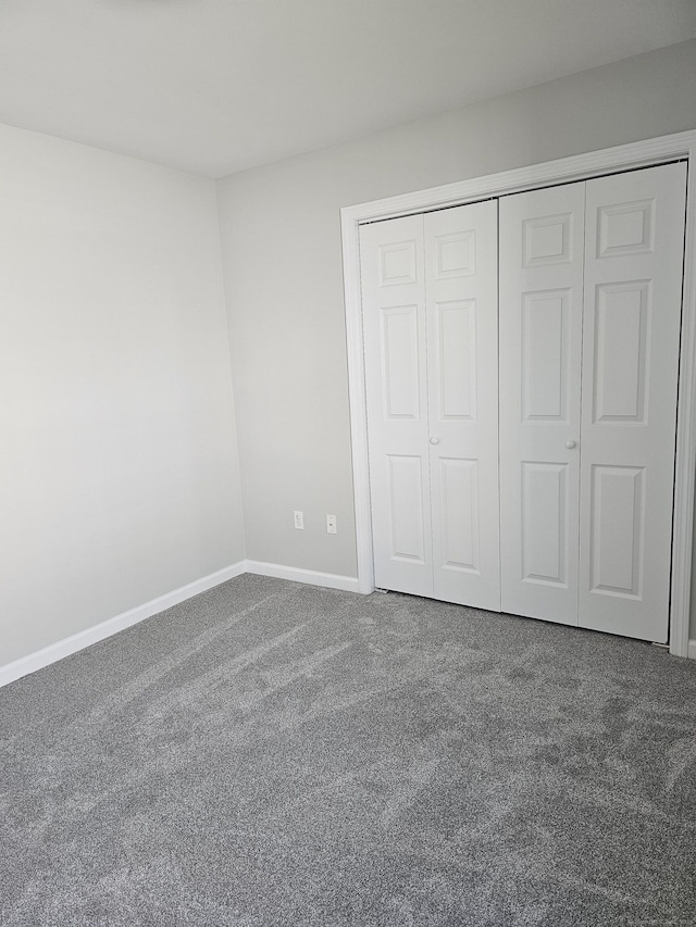 26 Roger Ave, Danbury, CT 06810 - unfurnished bedroom with carpet floors and a closet