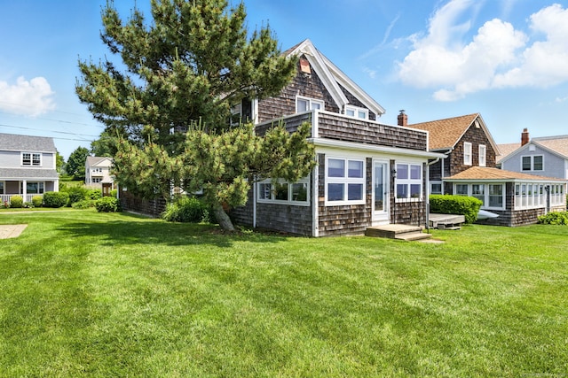 226 Old Kelsey Point Rd, Westbrook, CT 06498 - rear view of house featuring a yard and a chimney