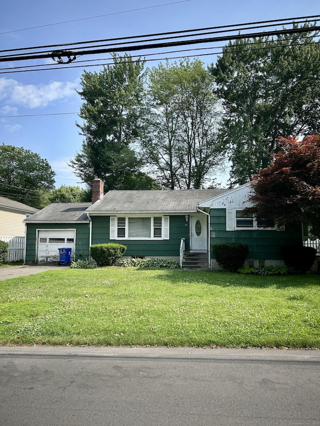 71 Saddle Rd, Norwalk, CT 06851 - view of front facade featuring a chimney, a front lawn, driveway, and entry steps