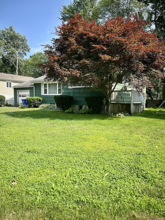 71 Saddle Rd, Norwalk, CT 06851 - view of grassy yard with a garage