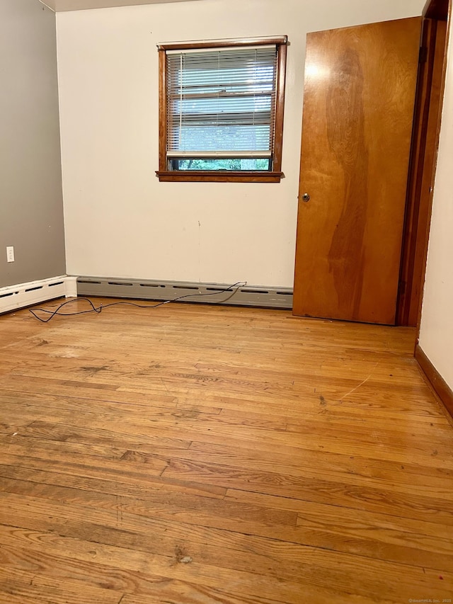 71 Saddle Rd, Norwalk, CT 06851 - unfurnished room featuring wood finished floors and a baseboard radiator
