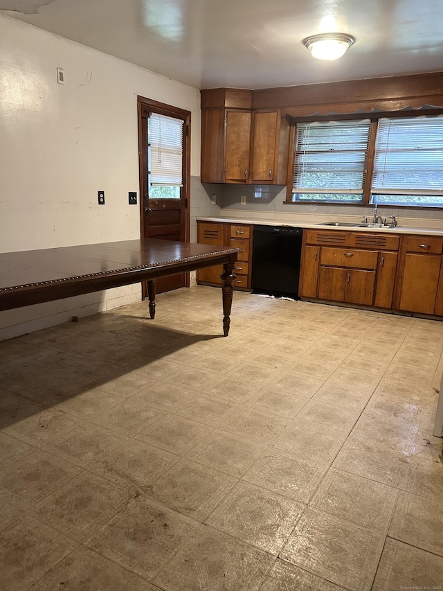 71 Saddle Rd, Norwalk, CT 06851 - kitchen with dishwasher, brown cabinetry, and light countertops