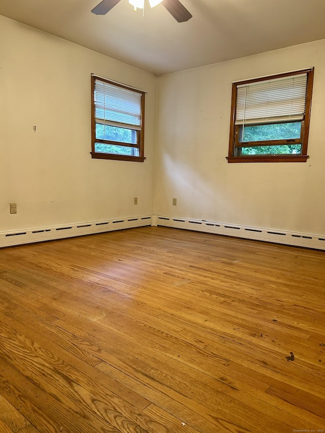 71 Saddle Rd, Norwalk, CT 06851 - spare room featuring wood finished floors, a ceiling fan, and a baseboard heating unit