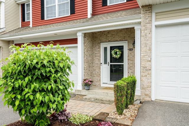 90 Bridlewood Ln Unit 90, Vernon, CT 06066 - entrance to property featuring roof with shingles and an attached garage
