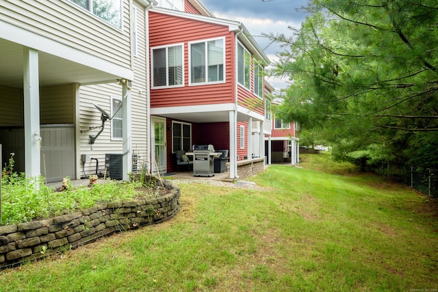 90 Bridlewood Ln Unit 90, Vernon, CT 06066 - rear view of house with a yard and a patio