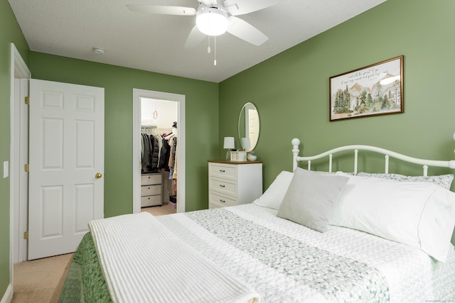 90 Bridlewood Ln Unit 90, Vernon, CT 06066 - bedroom with light colored carpet, a spacious closet, a closet, and ceiling fan