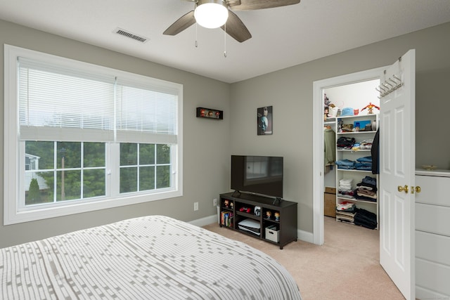 90 Bridlewood Ln Unit 90, Vernon, CT 06066 - bedroom featuring a spacious closet, light colored carpet, a closet, and ceiling fan