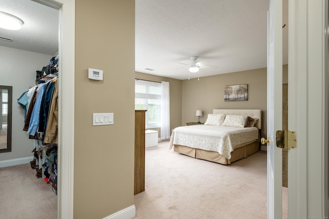 90 Bridlewood Ln Unit 90, Vernon, CT 06066 - bedroom with a textured ceiling, light carpet, and ceiling fan