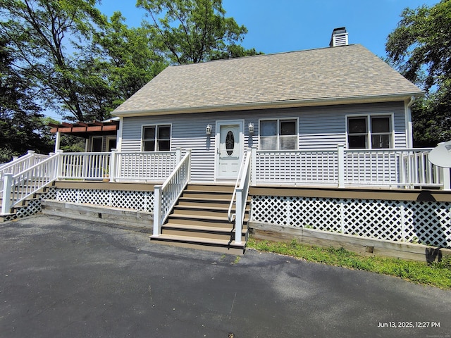43 Rte 87, Columbia, CT 06237 - view of front of house featuring roof with shingles, a chimney, and a wooden deck