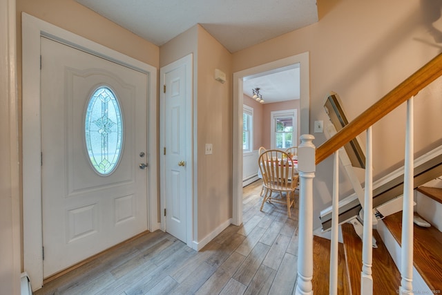 43 Rte 87, Columbia, CT 06237 - entryway with light wood-style floors, stairs, and a baseboard radiator