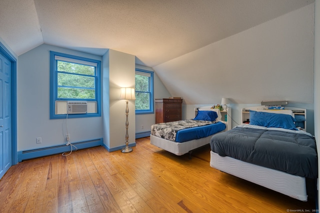 43 Rte 87, Columbia, CT 06237 - bedroom featuring baseboard heating, cooling unit, light wood finished floors, vaulted ceiling, and a textured ceiling