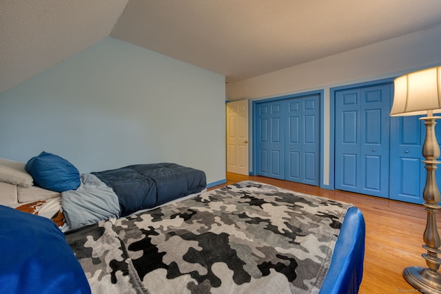 43 Rte 87, Columbia, CT 06237 - bedroom with multiple closets, wood finished floors, and vaulted ceiling
