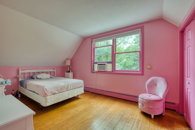 43 Rte 87, Columbia, CT 06237 - bedroom with a baseboard heating unit, vaulted ceiling, light wood-type flooring, cooling unit, and a textured ceiling