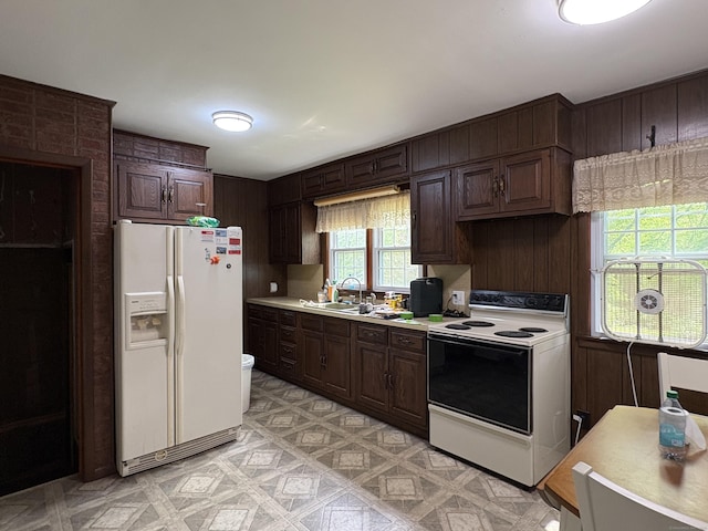 520 River Rd, Lisbon, CT 06351 - kitchen with white refrigerator with ice dispenser, range with electric cooktop, light countertops, dark brown cabinets, and light flooring