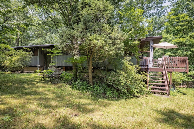88 Hillyndale Rd, Mansfield, CT 06268 - view of grassy yard featuring stairs and a deck