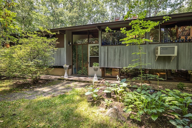 88 Hillyndale Rd, Mansfield, CT 06268 - doorway to property featuring a wall unit AC