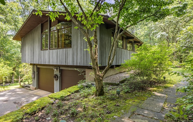 88 Hillyndale Rd, Mansfield, CT 06268 - view of property exterior with a garage and asphalt driveway