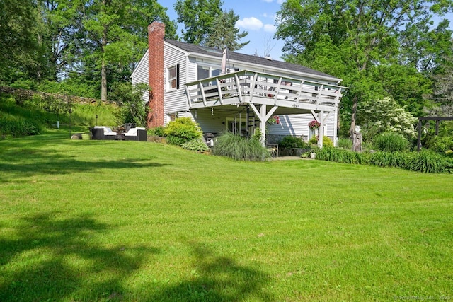 296 Black Rock Tpke, Redding, CT 06896 - back of house with a deck, a chimney, a yard, and roof with shingles