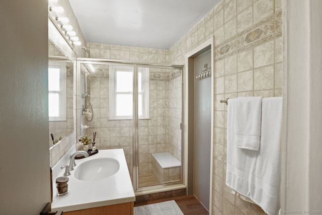 296 Black Rock Tpke, Redding, CT 06896 - bathroom featuring vanity, a shower stall, tile walls, and wood finished floors