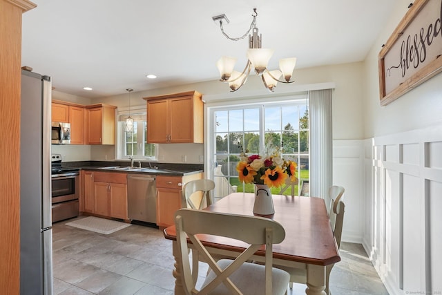 36 Ernest Ave, Waterbury, CT 06708 - kitchen with appliances with stainless steel finishes, a chandelier, dark countertops, recessed lighting, and pendant lighting