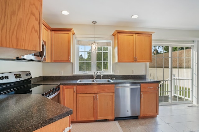 36 Ernest Ave, Waterbury, CT 06708 - kitchen featuring stainless steel appliances, plenty of natural light, decorative light fixtures, light tile patterned floors, and recessed lighting