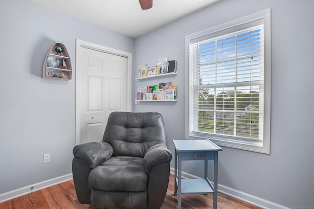 36 Ernest Ave, Waterbury, CT 06708 - sitting room with plenty of natural light, wood finished floors, and a ceiling fan