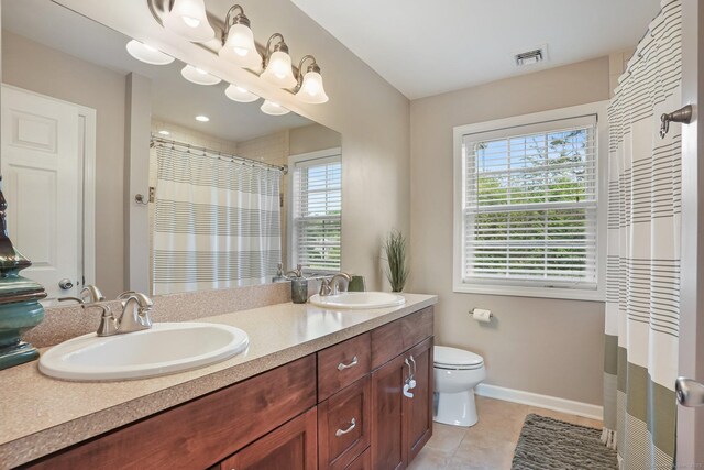 36 Ernest Ave, Waterbury, CT 06708 - bathroom with double vanity, tile patterned flooring, and curtained shower